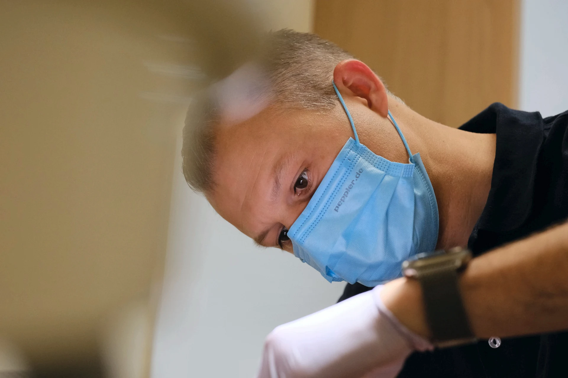 Dr. Dennis William Hickey treating a patient