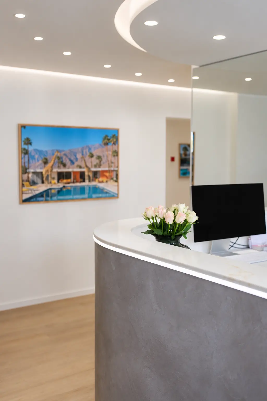 Our practice reception with flowers on the curved counter